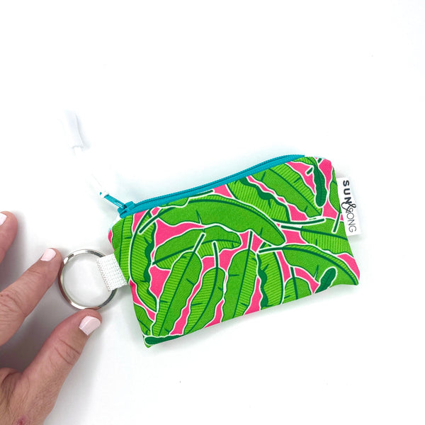 banana leaves and pink small zipper pouch